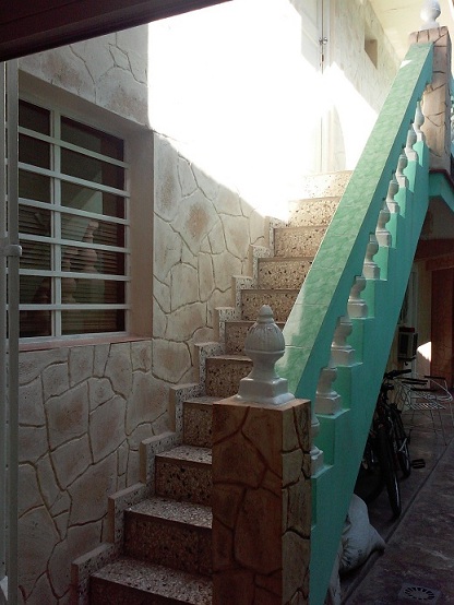 'Escaleras hacia las habitaciones' Casas particulares are an alternative to hotels in Cuba.